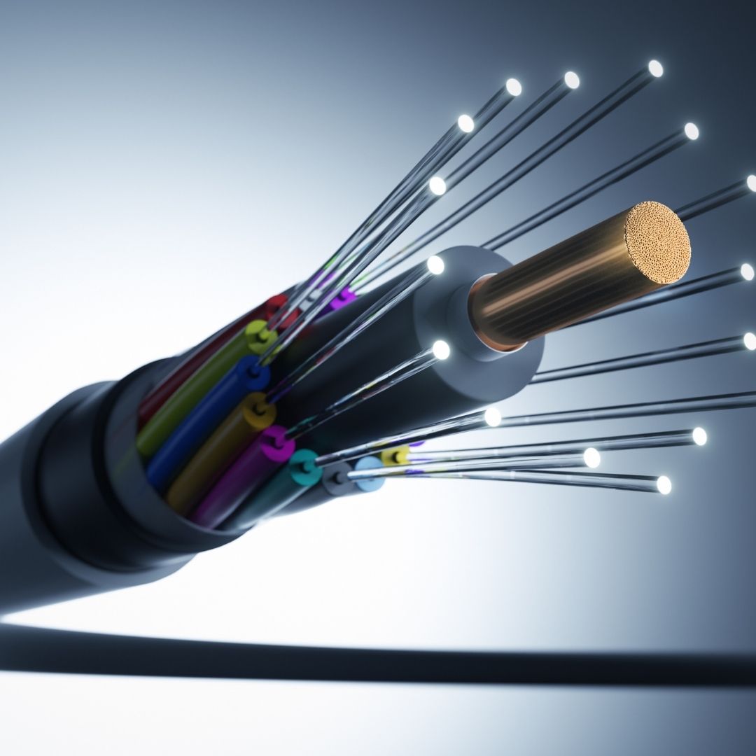 A close-up of a fiber optic cable illustrating high-speed data transmission, highlighting the difference between Cat5e and Cat6a for networking solutions.