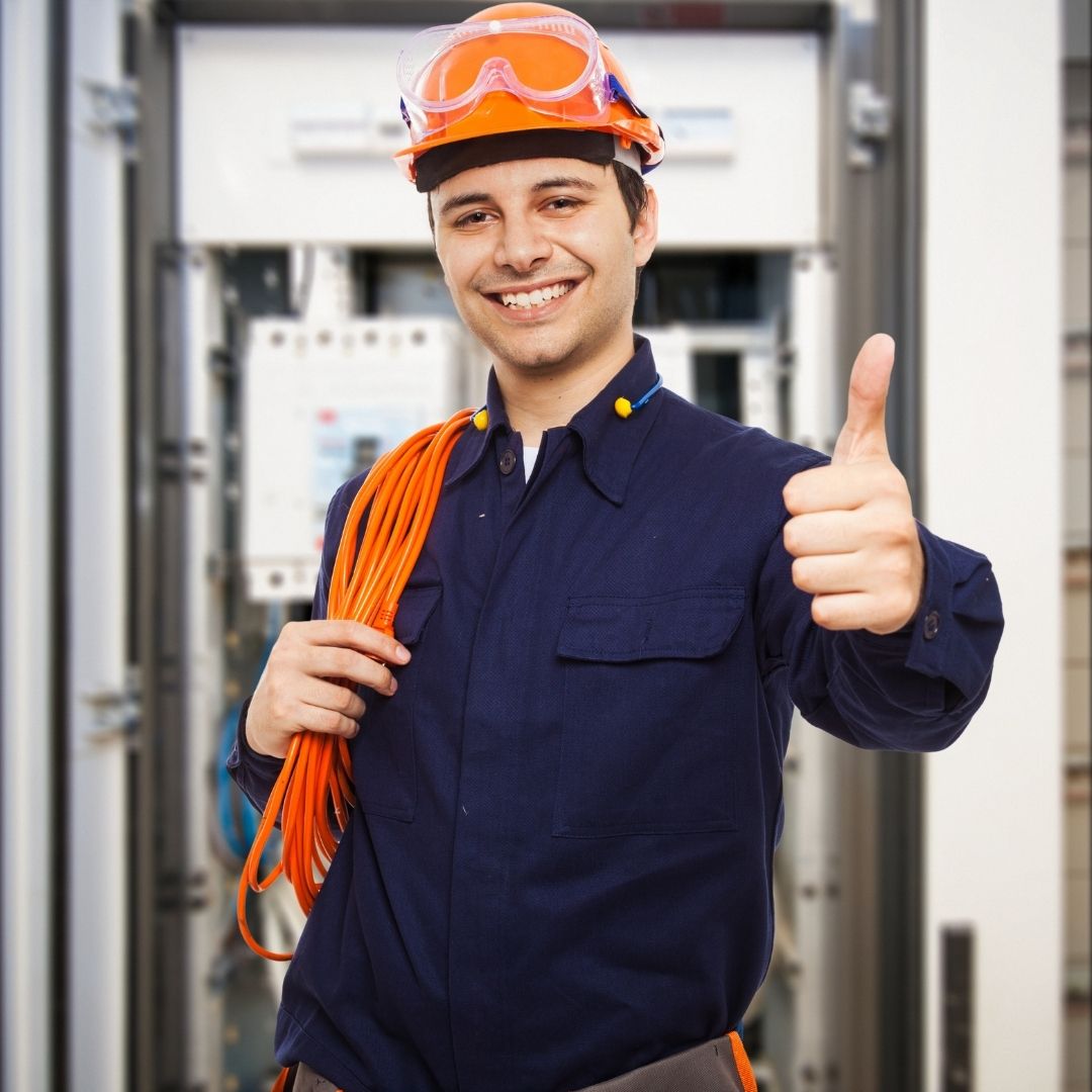 A professional Electrician Barangaroo giving a thumbs up, holding electrical cables, and ready to provide top-quality electrical services.