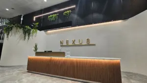 This image shows the completed Nexus foyer reception, where a professional electrical office fit-out delivered a sleek and functional space.