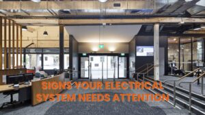 Office lobby and entryway with industrial features like exposed ductwork, emphasizing the environment where electrical maintenance issues can arise.