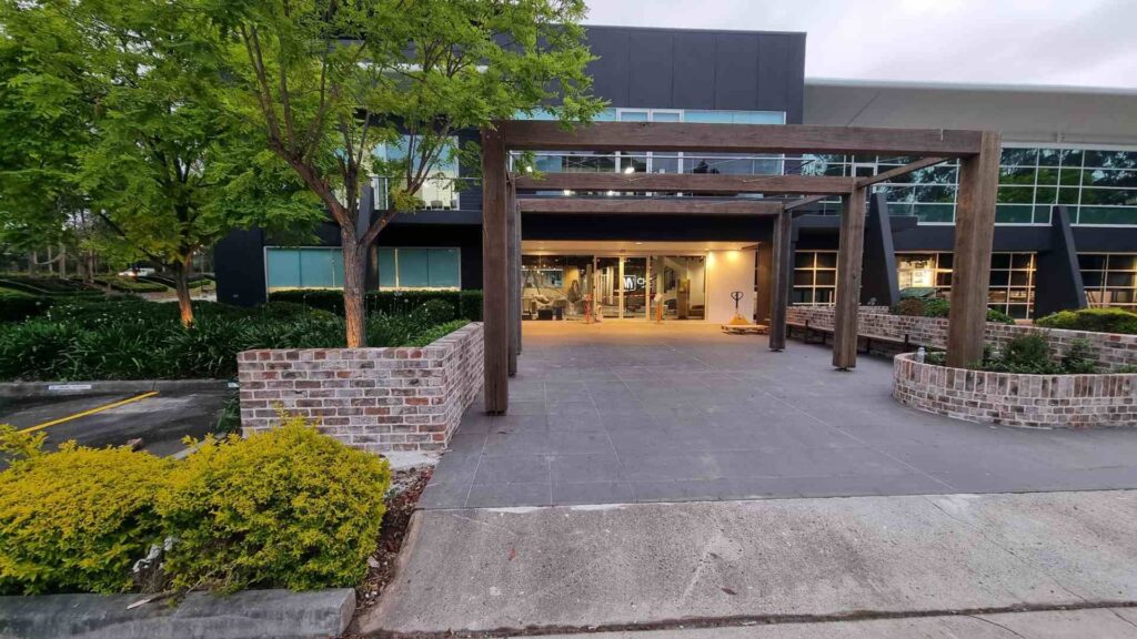 Sydney's Best Residential Electrician. A stylish, modern building entrance featuring custom outdoor lighting, which requires specialized electrical planning and installation. This image targets discerning homeowners looking for the best residential electrician capable of handling high-end and detailed work, including outdoor landscape and security lighting to enhance the curb appeal and safety of their property.