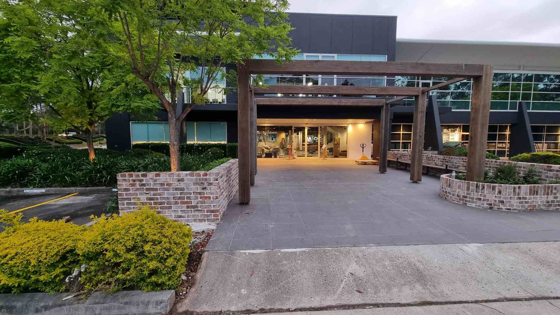 Sydney's Best Residential Electrician. A stylish, modern building entrance featuring custom outdoor lighting, which requires specialized electrical planning and installation. This image targets discerning homeowners looking for the best residential electrician capable of handling high-end and detailed work, including outdoor landscape and security lighting to enhance the curb appeal and safety of their property.