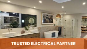 Sydney's Best Residential Electrician. A luxurious bathroom setting demanding precise and safe electrical work for lighting, fans, and potential heated floors. The need for specialized installation in wet areas is critical. The overlay, "TRUSTED ELECTRICAL PARTNER", and the context of the image promote the company as the best residential electrician for intricate, high-value home renovations and new luxury construction.