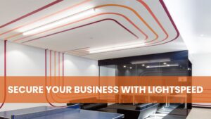 A modern office recreation area with a blue ping pong table and an orange banner reading "SECURE YOUR BUSINESS WITH LIGHTSPEED."