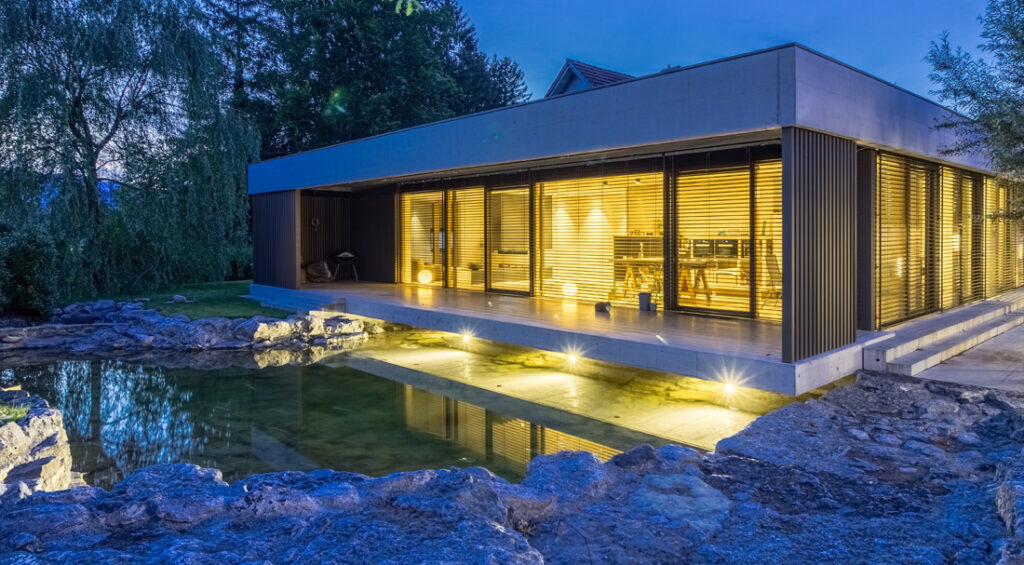 Lightspeed commercial electrician in Sydney completing exterior and interior electrical rewiring for a luxury residence with pool lighting.